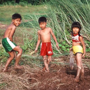 Lao kids playing in the mud