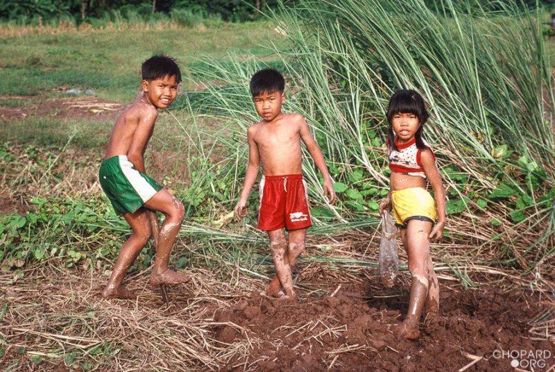 Lao kids playing in the mud